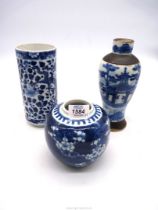 Three pieces of Oriental blue and white china including a Chinese vase decorated with peonies and