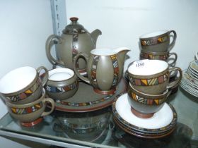 A Denby 'Marrakesh' Teaset for six including teapot and cake stand, (lid missing from sugar bowl).