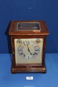 A Mahogany cased Bracket Clock having bevelled glass panels,