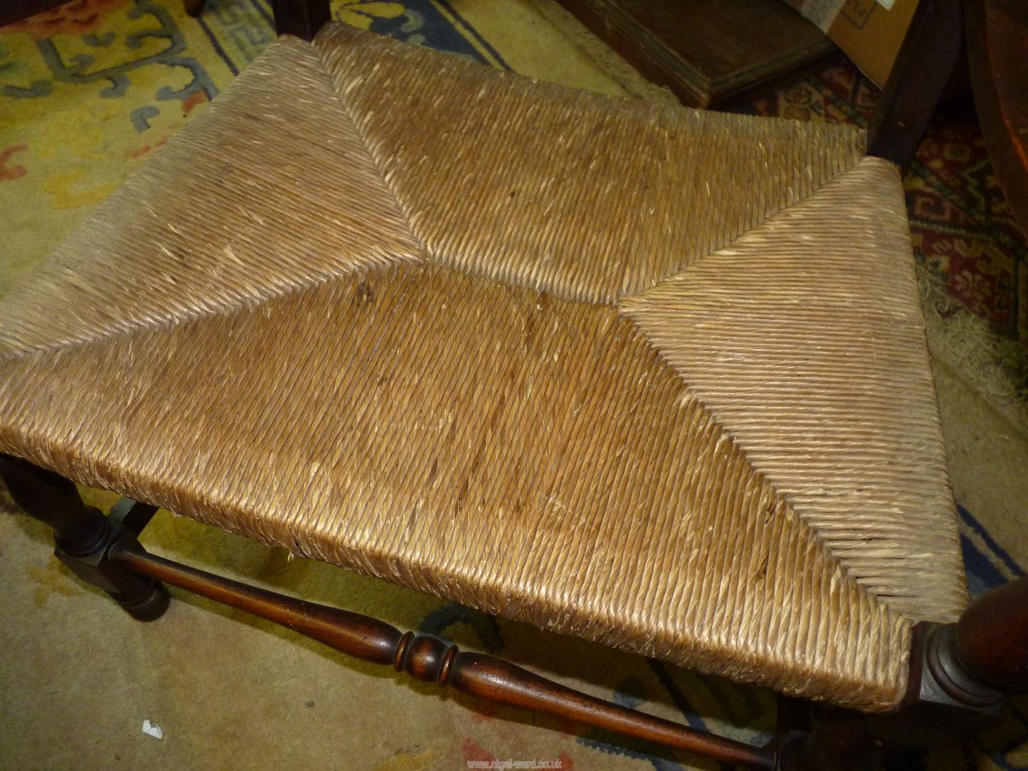 A Mahogany framed low open armed Elbow Chair standing on turned front legs and having a woven - Image 5 of 6
