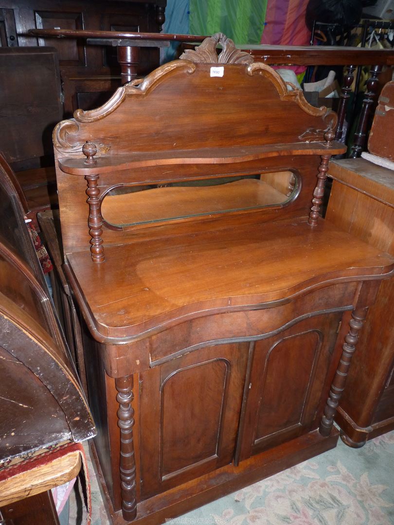 A compact Mahogany Sideboard having a frieze drawer and a pair of opposing drawers below,