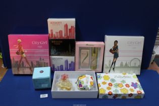 A box of perfumes/cosmetics including boxed Zandra Rhodes 'Button Flower' 50ml eau de parfum and