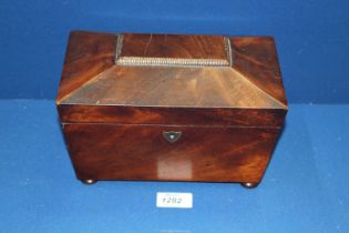 A Rosewood Tea Caddy of sarcophagus form with button feet, 9'' x 5 1/4'' x 5'' high.