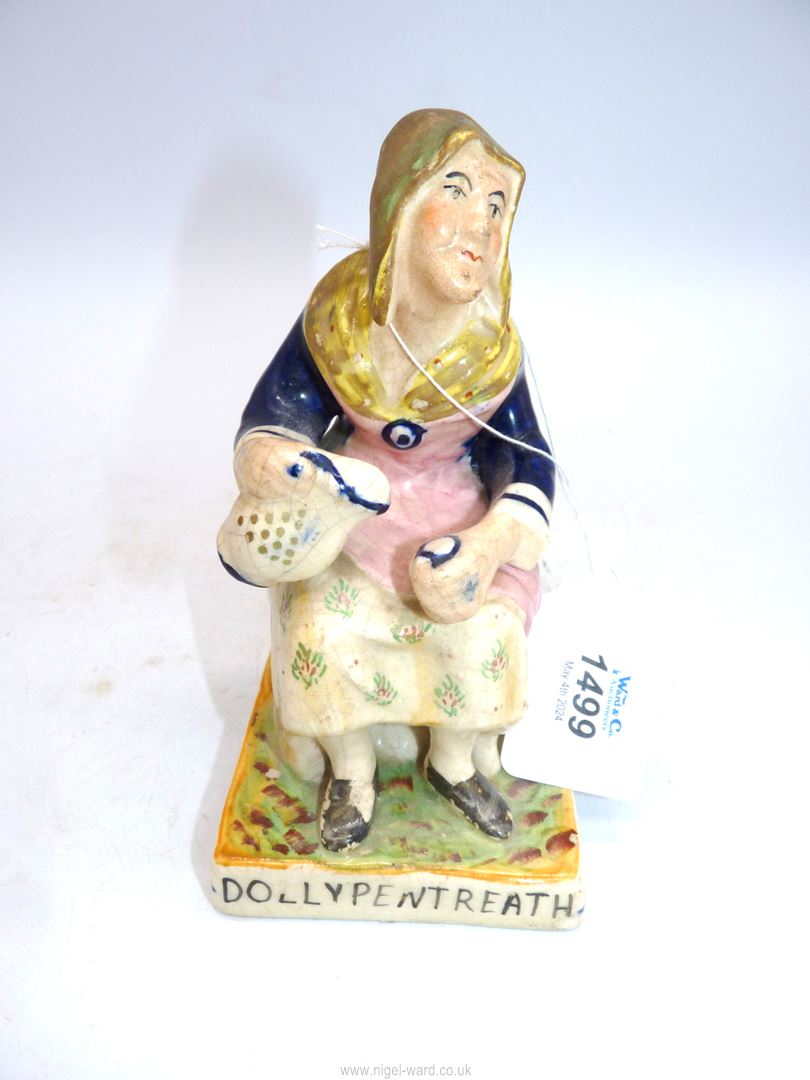 A Staffordshire figure of Dolly Pentreath - the last Cornish woman to speak the language, 7" tall.