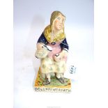 A Staffordshire figure of Dolly Pentreath - the last Cornish woman to speak the language, 7" tall.