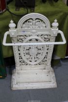 A cream painted cast iron Umbrella/stick stand with drip tray, 29" tall.