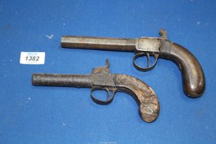 Two Percussion Pistols, one being a top hammer,
