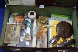 A vintage Suitcase and contents including mixed vintage items, old books, photographs, newspapers,