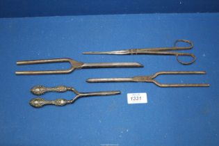 Four early iron curling tongs, one have hallmarked silver handles (Birmingham hallmark). ***V.A.T.