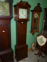 An Oak cased Longcase Clock by Carter, Salisbury, the 30 hour movement striking the hours on a bell,