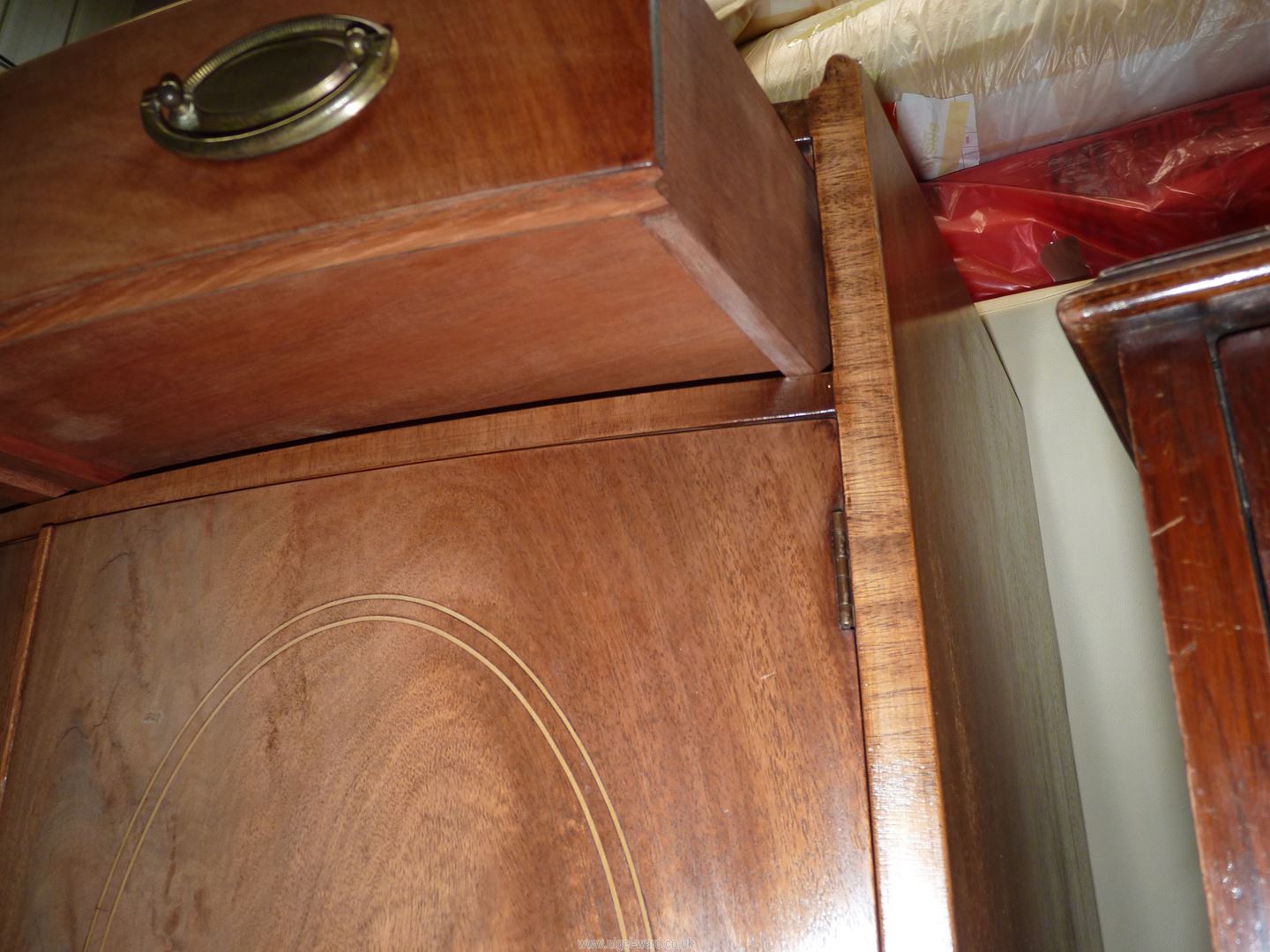 A Mahogany bow fronted Cabinet having a pair of opposing doors with oval Boxwood stringing, - Image 2 of 4