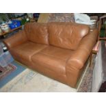 A two/three seater brown upholstered Settee.