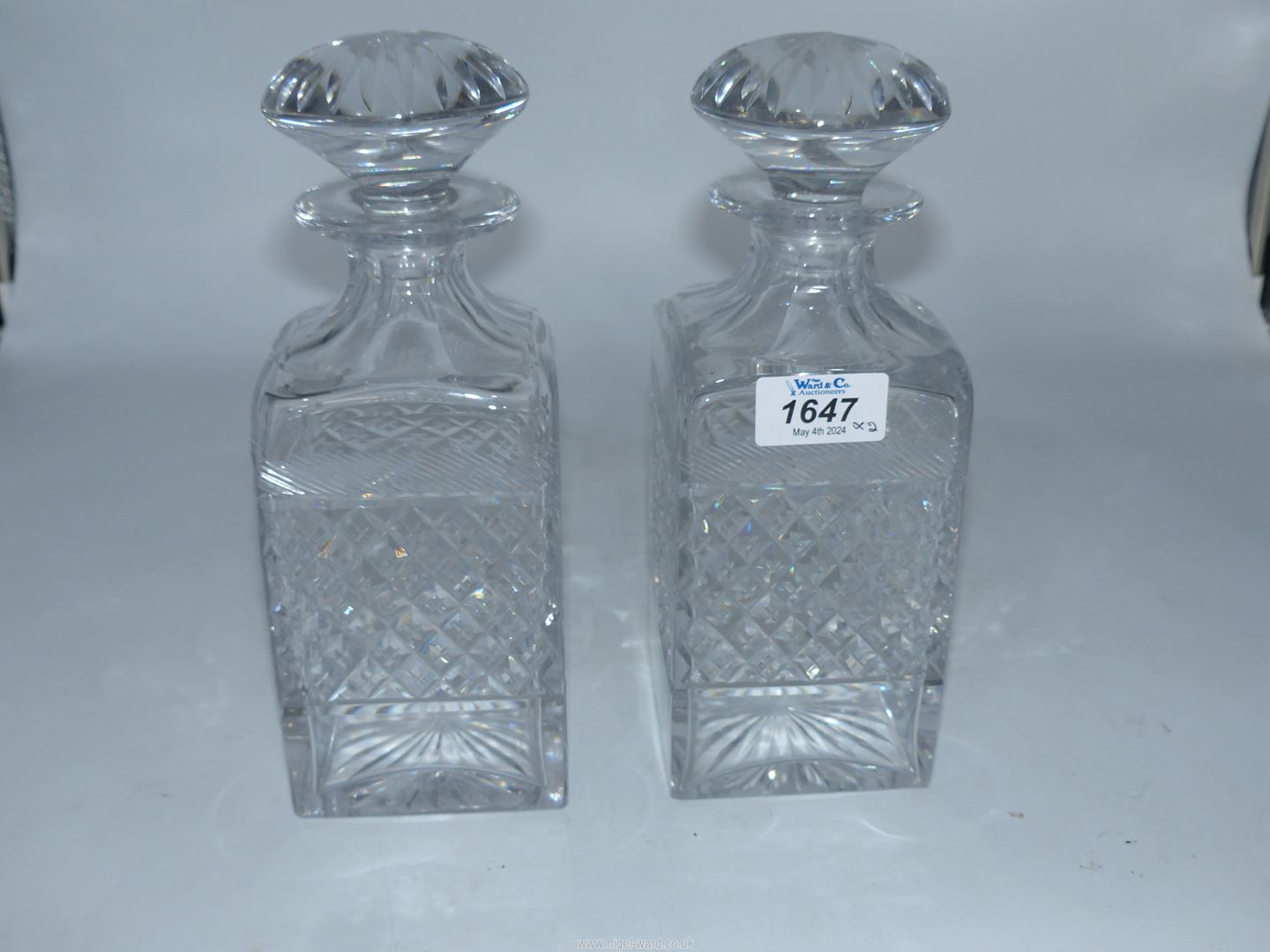A pair of Tudor crystal square decanters with mushroom stoppers.