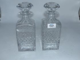 A pair of Tudor crystal square decanters with mushroom stoppers.