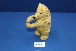 An antique clockwork Teddy Bear, a/f, 5 1/2'' tall.