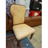 A Mahogany framed beige upholstered Chair standing on mirrored twist front legs.