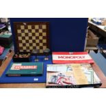 A box of games to include; complete Chess set, Monopoly, Scrabble, etc.