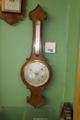 An Oak cased Aneroid Barometer with thermometer, glass cracked, 34'' long overall.