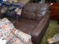 A brown leather Settee.