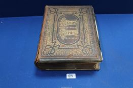 A large Brown's Colour Illustrated Family Bible, leather and metal bound with clasps,