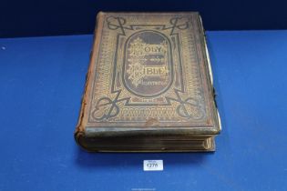 A large Brown's Colour Illustrated Family Bible, leather and metal bound with clasps,