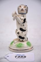 An unusual early 18th century Staffordshire begging spaniel (some damage and restoration),
