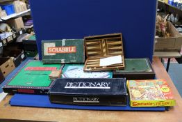 A quantity of games including; a Remy Martin 'Captains Mistress' game (boxed), Scrabble De Luxe,
