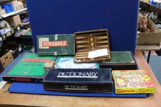 A quantity of games including; a Remy Martin 'Captains Mistress' game (boxed), Scrabble De Luxe,