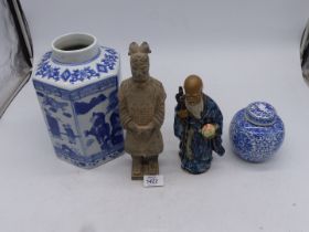 A large Chinese tea container featuring on each panel a blue screen of Chinese life 10" tall,