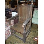 A heavy old Oak Armchair of Bardic/Mayoral design having a solid seat,