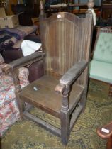 A heavy old Oak Armchair of Bardic/Mayoral design having a solid seat,