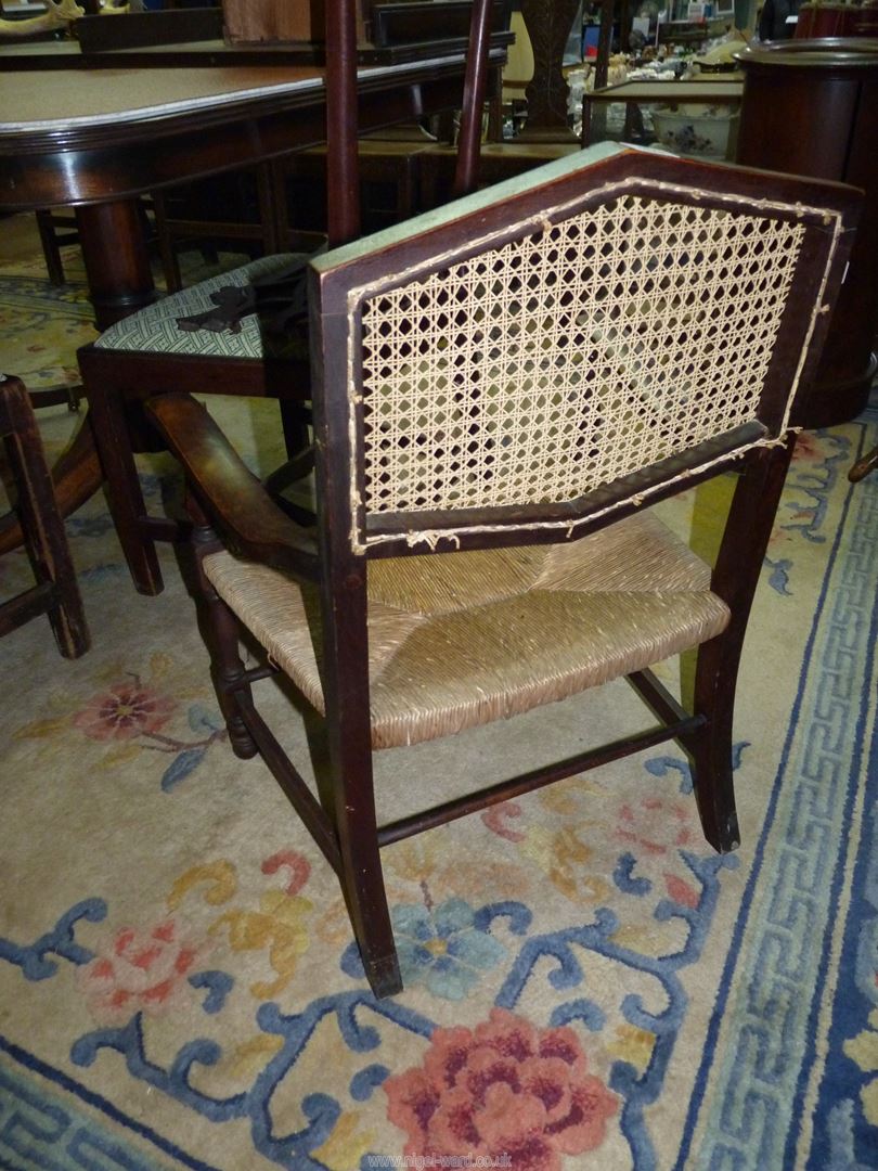 A Mahogany framed low open armed Elbow Chair standing on turned front legs and having a woven - Image 2 of 6