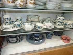 A quantity of Staffordshire 'Midwinter' dinner ware to include; seven dinner and side plates,