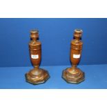A pair of turned wooden Candlesticks with weighted bases, 12'' tall.
