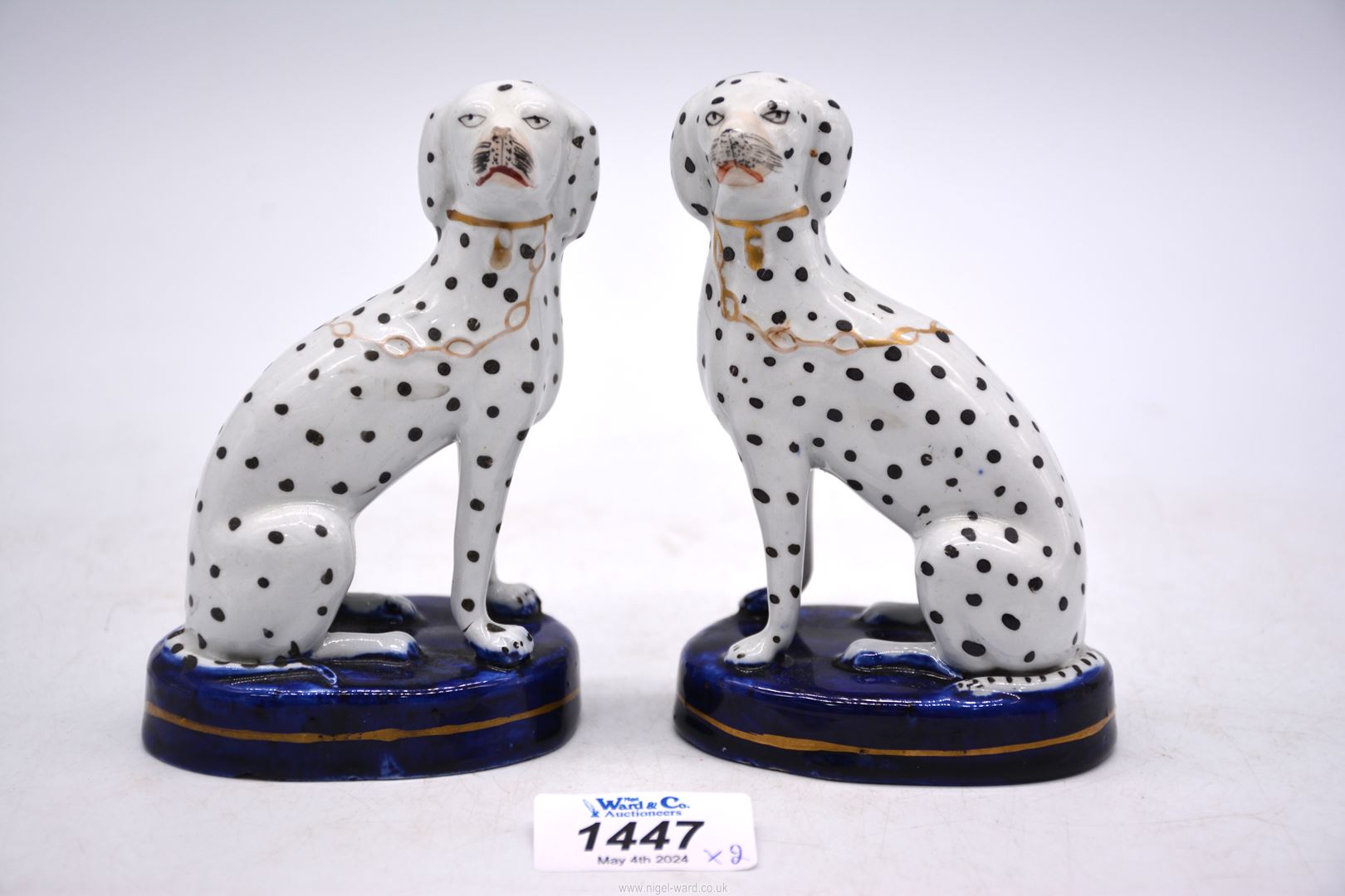 A pair of miniature Staffordshire seated Dalmations, 5" tall.