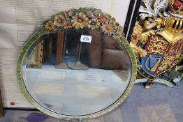 A circular Barbola wall mirror, bevelled, 19" diameter.