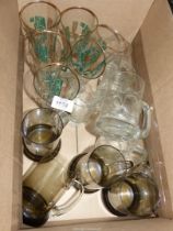 A quantity of beer glasses including; Studio and smoky tankards, lager glasses, etc.