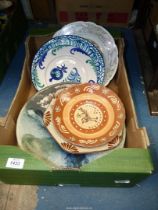 A quantity of Studio Pottery including; a large charger, mosaic lily design charger,