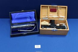 Two medical kits; Kolormeter in wooden box and ENT Probe Light.