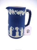 A blue Wedgwood Jasperware jug, circa 1910, 5 1/2" tall.