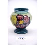 A small Moorcroft vase in Hibiscus pattern, 3 1/2" tall.