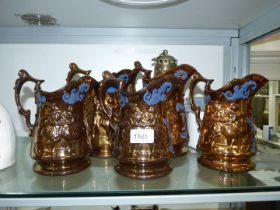 Five Staffordshire lustre jugs, circa 1880,