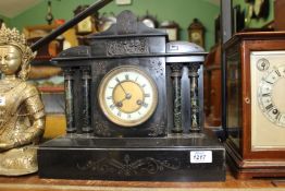 A two train slate Mantle Clock having Roman numerals with pendulum and key, 14" wide x 12 1/2" high.