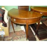 A circa 1900 Mahogany semi-circular Side Table standing on tapering square legs terminating in