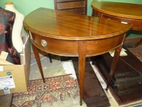 A circa 1900 Mahogany semi-circular Side Table standing on tapering square legs terminating in
