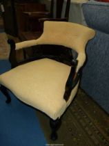 A black painted framed Bow back Armchair having shaped fretworked back supports,