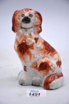 A Staffordshire spaniel with ochre patches, 6" tall.