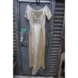 A Duchess silk satin Wedding Dress having metallic thread and beading detail to the front and