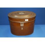 A metal hat box with lock and key, 15 3/4" wide x 11" high.
