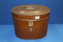 A metal hat box with lock and key, 15 3/4" wide x 11" high.